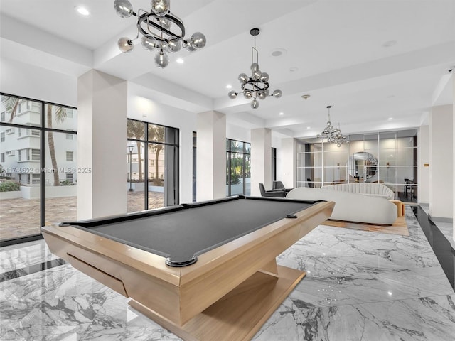 rec room with an inviting chandelier and billiards