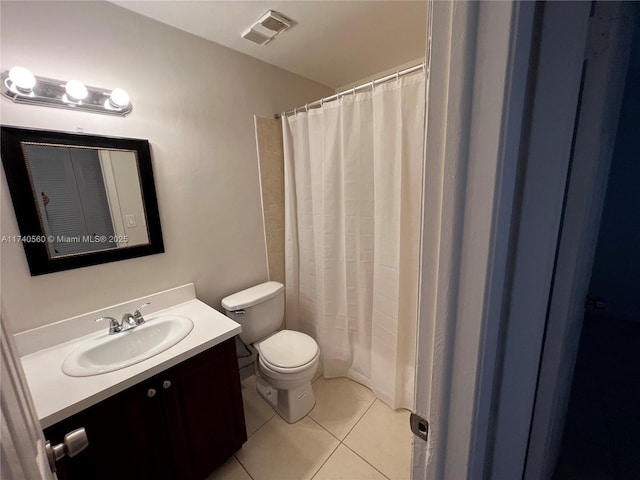 bathroom with tile patterned flooring, vanity, a shower with shower curtain, and toilet