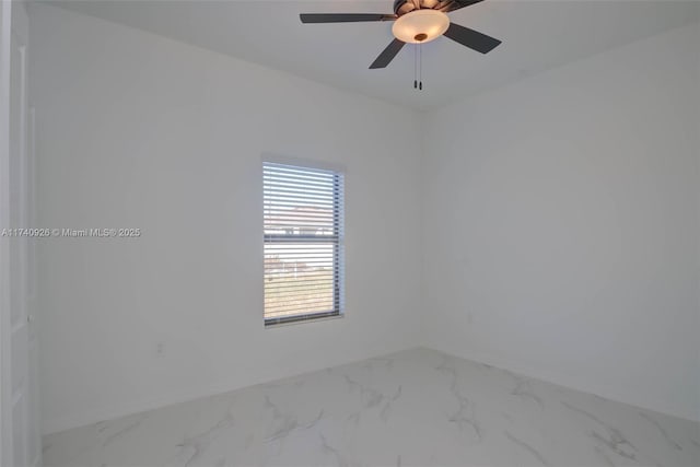 spare room with ceiling fan