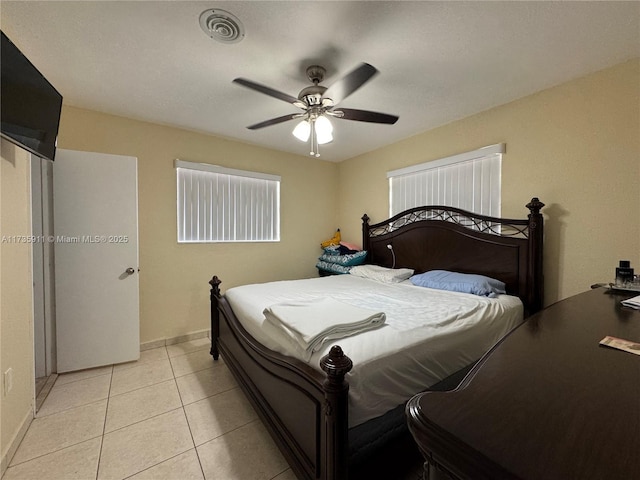 bedroom with light tile patterned floors and ceiling fan