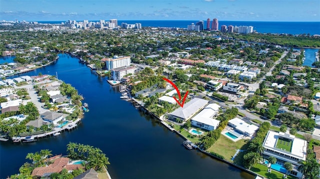 birds eye view of property with a water view