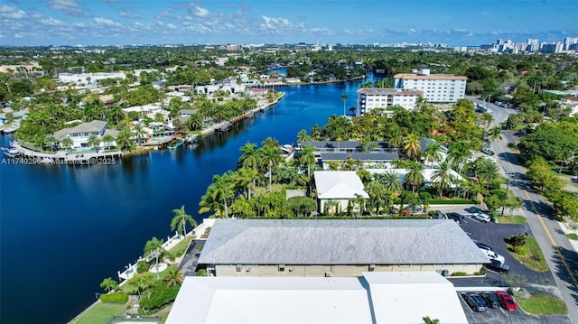 birds eye view of property featuring a water view