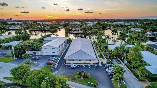 aerial view at dusk with a water view