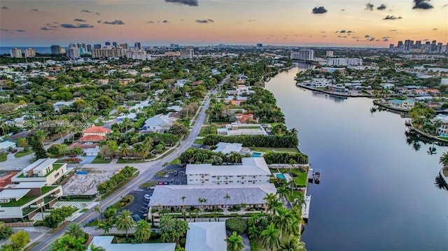 aerial view at dusk with a water view