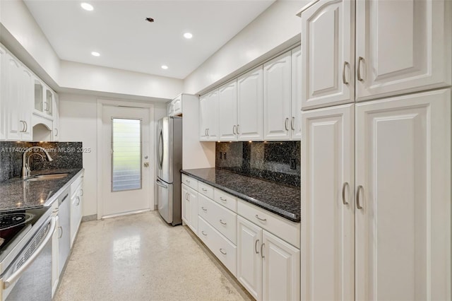 kitchen featuring stainless steel appliances, white cabinetry, and sink