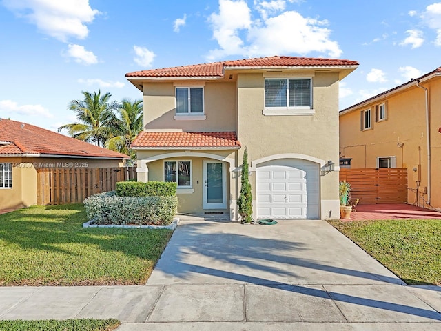 mediterranean / spanish-style house featuring a tiled roof, a garage, stucco siding, fence, and concrete driveway