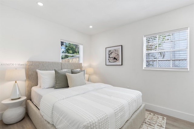 bedroom with light hardwood / wood-style flooring