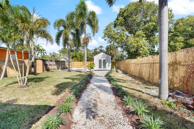 view of yard with an outdoor structure