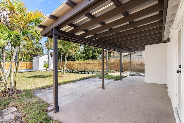 view of patio / terrace with a shed