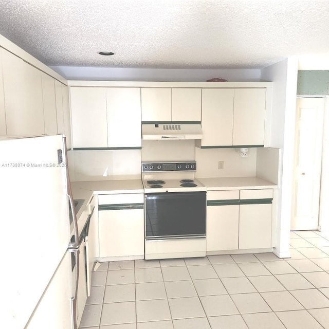 kitchen featuring light countertops, electric range, freestanding refrigerator, a textured ceiling, and under cabinet range hood