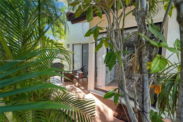 view of side of home featuring a patio