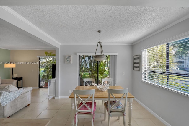 dining room with ornamental molding and light tile patterned floors