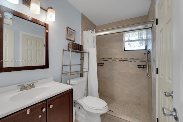 bathroom with vanity, toilet, and a shower with shower curtain