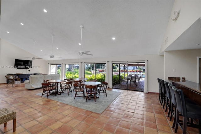 tiled dining area featuring high vaulted ceiling and ceiling fan