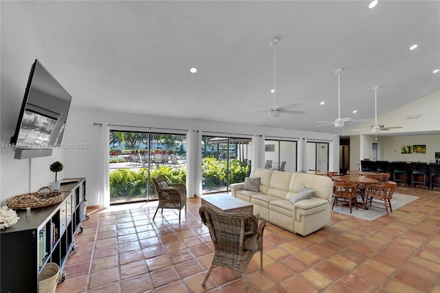 living room featuring lofted ceiling and light tile patterned floors