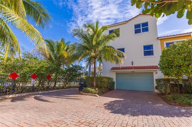 1799 NW 124th Way Unit 1799, Pembroke Pines, FL 33028 - mediterranean / spanish home featuring stucco siding, a tiled roof, an attached garage, decorative driveway, and fence