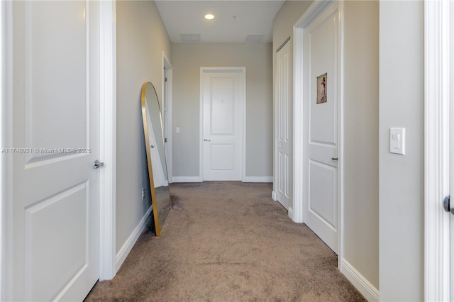 corridor with carpet flooring