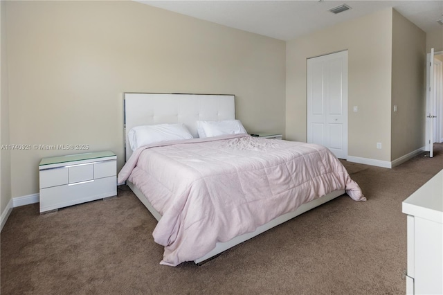 carpeted bedroom featuring a closet