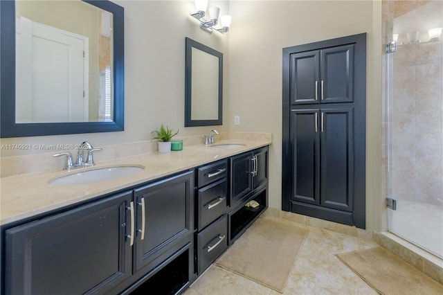 bathroom featuring vanity, an enclosed shower, and tile patterned floors