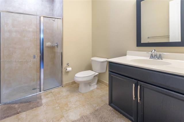 bathroom featuring walk in shower, vanity, toilet, and tile patterned flooring