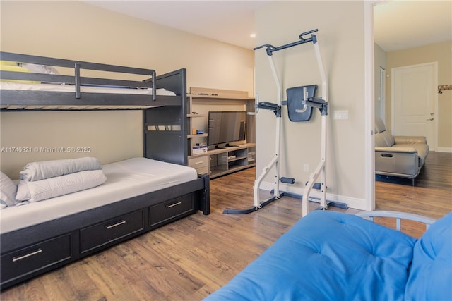 bedroom with wood-type flooring