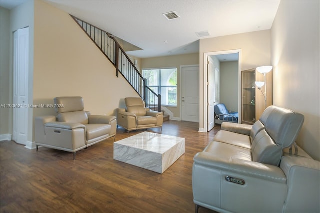 living room with dark hardwood / wood-style flooring