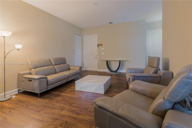 living room with dark hardwood / wood-style flooring