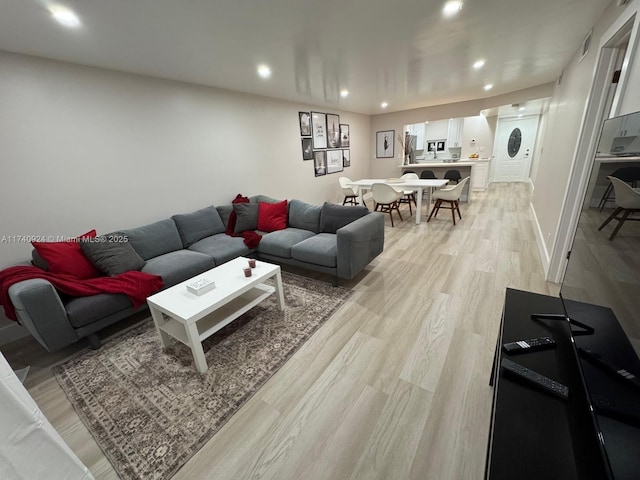 living room featuring light wood-type flooring