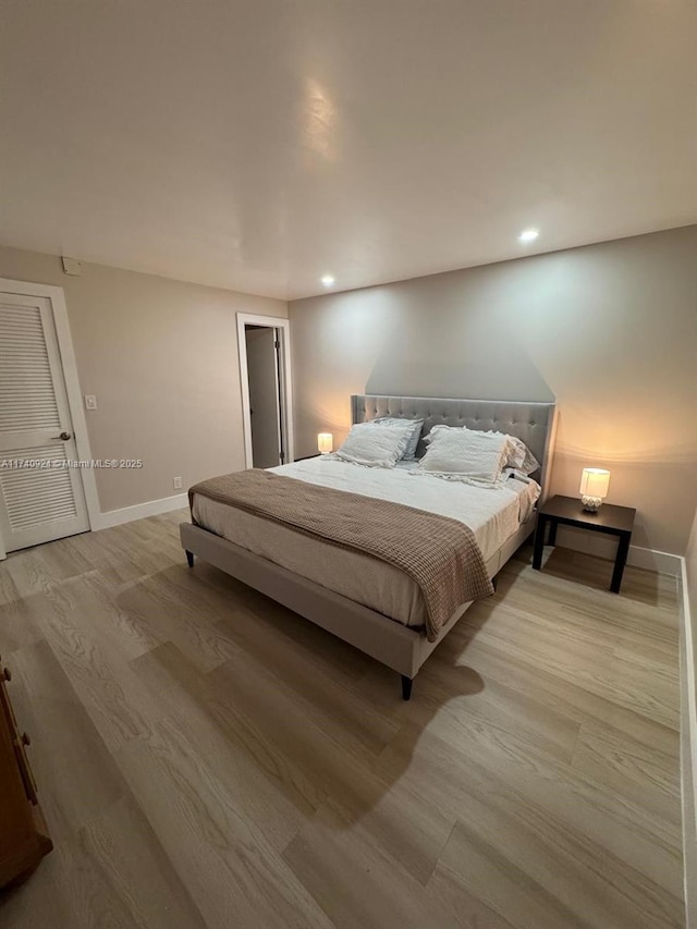 bedroom with light wood-type flooring