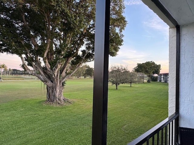 view of yard at dusk