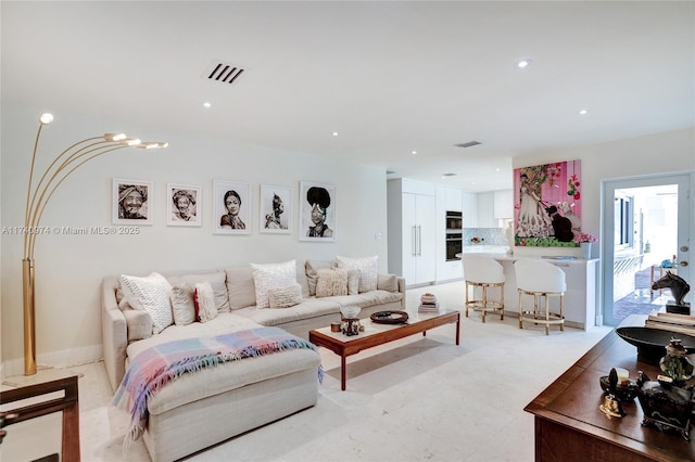 living room with visible vents and recessed lighting