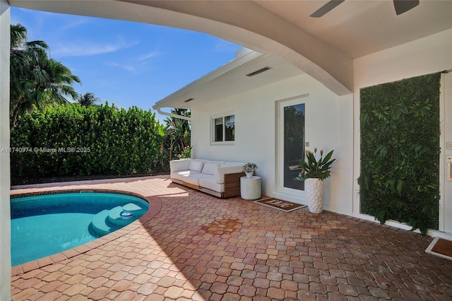 view of pool featuring a patio area, outdoor lounge area, and a fenced in pool