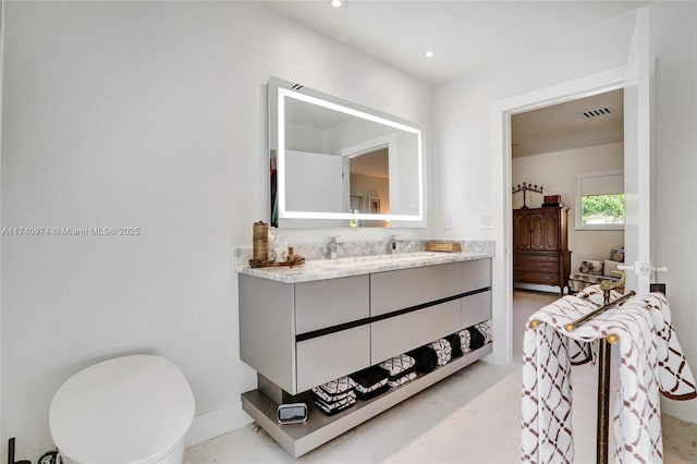 bathroom with recessed lighting, visible vents, vanity, and toilet