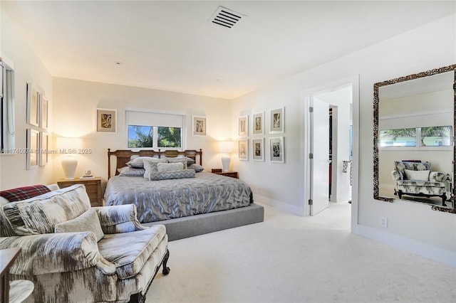 bedroom featuring baseboards, visible vents, and light colored carpet