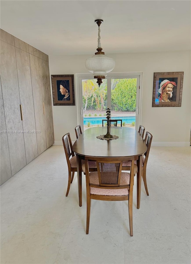 dining space with baseboards