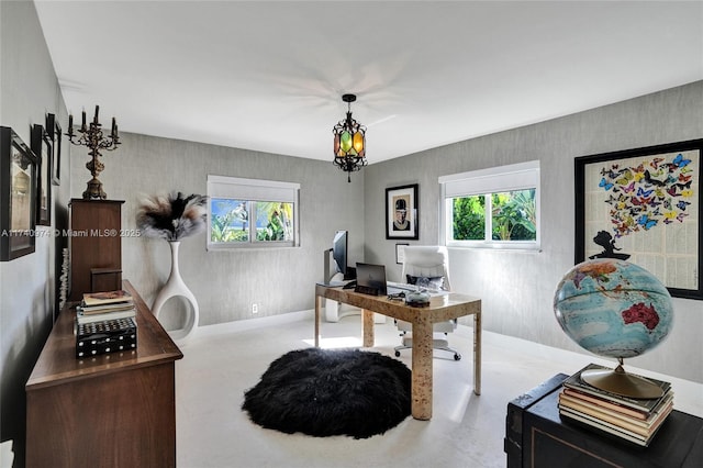 office featuring a chandelier and baseboards