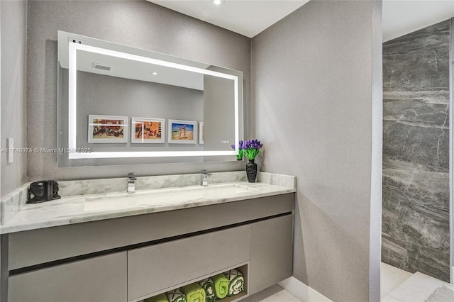 bathroom featuring visible vents and vanity