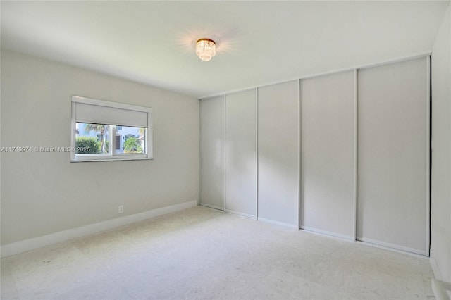 empty room with baseboards