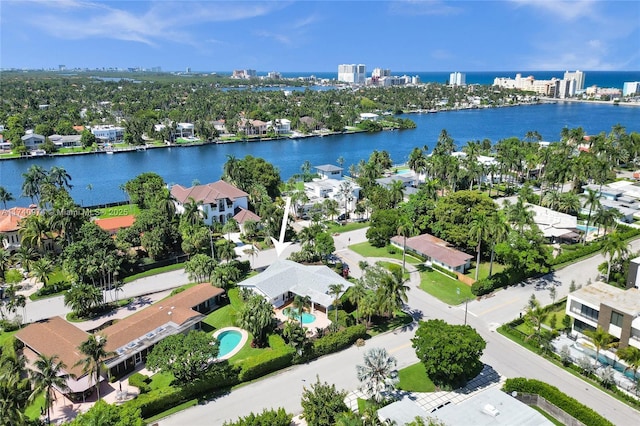 drone / aerial view with a water view and a residential view