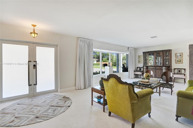 living area with french doors and visible vents