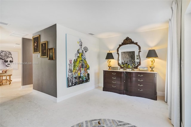 bedroom featuring baseboards and visible vents