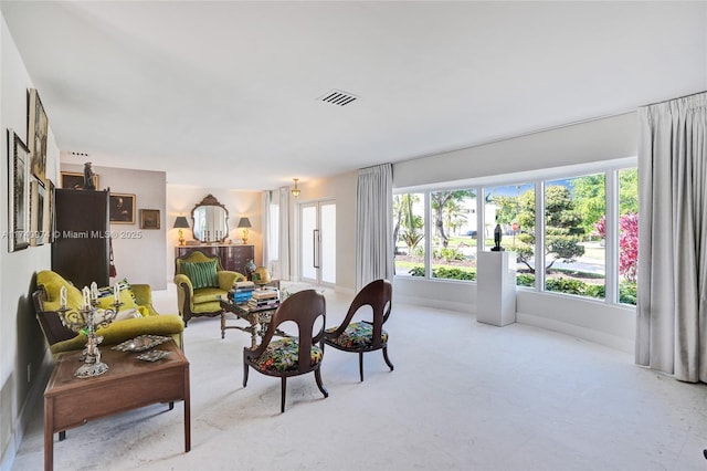 living room featuring visible vents