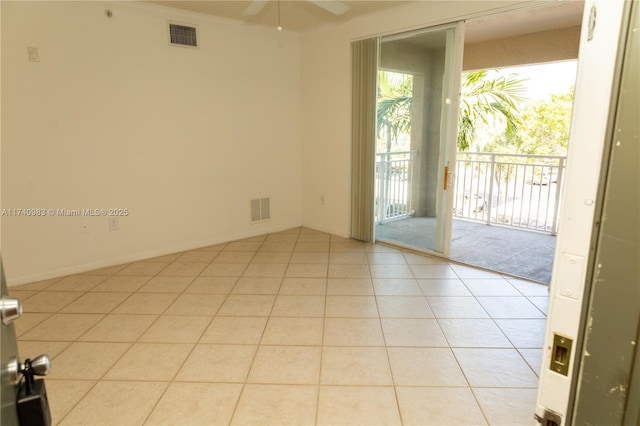 empty room with light tile patterned flooring, crown molding, and ceiling fan