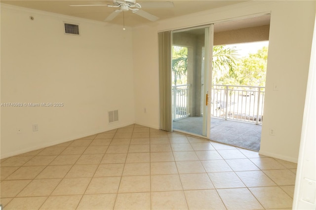 empty room with light tile patterned floors, crown molding, and ceiling fan