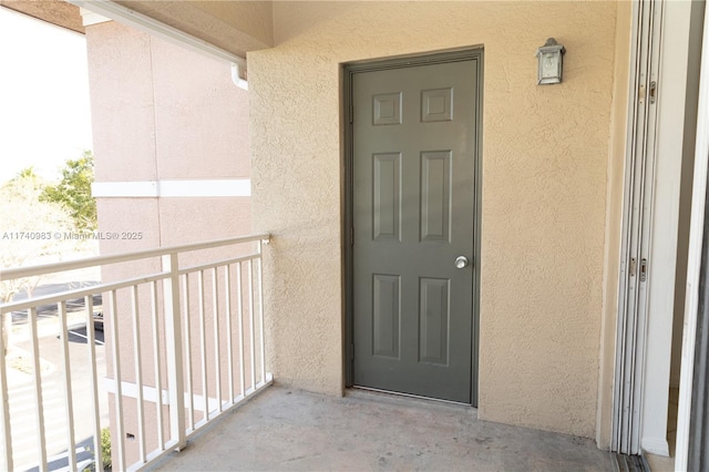 doorway to property featuring a balcony