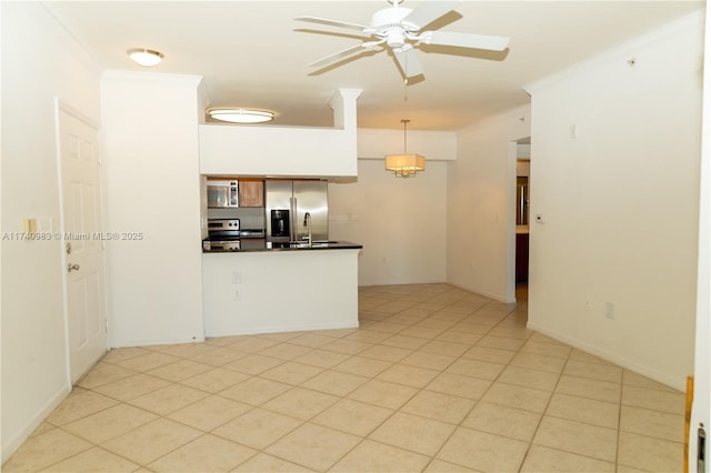 kitchen featuring crown molding, ceiling fan, appliances with stainless steel finishes, and hanging light fixtures