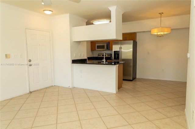 kitchen with appliances with stainless steel finishes, hanging light fixtures, ornamental molding, ceiling fan, and kitchen peninsula