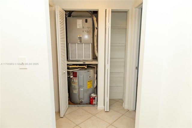 utility room featuring water heater