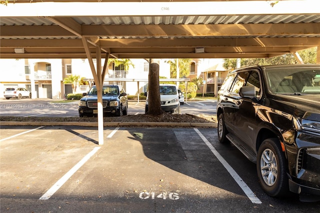 view of vehicle parking featuring a carport