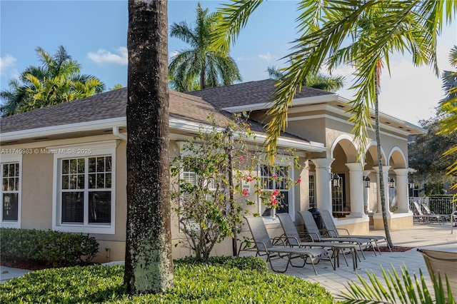 rear view of property featuring a patio